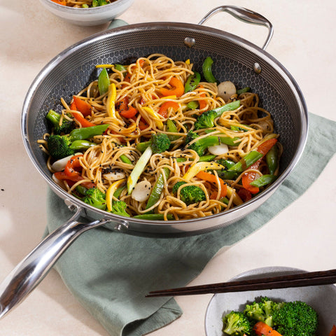 HexClad - Our 12” Hybrid Wok is currently on sale for 30% off for a limited  time! The HexClad Wok is 12” across and 3” deep, allowing for high volume  cooking and