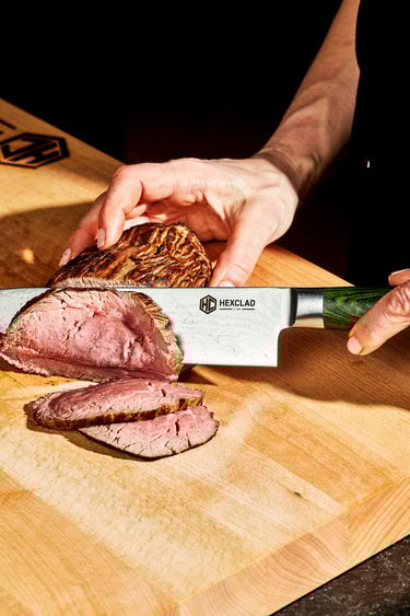 HexClad steak knife with a green wood handle